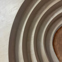 Close-up of a textured wall with concentric circular patterns
