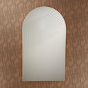 White arch-shaped object on a patterned brown background