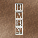 Wooden letter blocks spelling 'BABY' on a patterned brown background