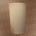Beige cylindrical object on a patterned brown background