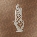 Decorative butterfly sculpture on a patterned background