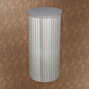 Decorative cylindrical pedestal with ribbed design on a patterned background