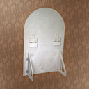 Decorative wall mirror with a geometric pattern on a matching background