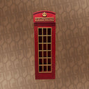 Red telephone booth with gold accents on a patterned wall