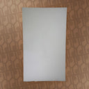 White rectangular object on a patterned brown surface