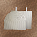 Two white textured mats on a patterned brown background