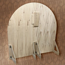 Wooden arch with metal brackets on a patterned background