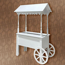 White decorative cart with a roof on a brown patterned background